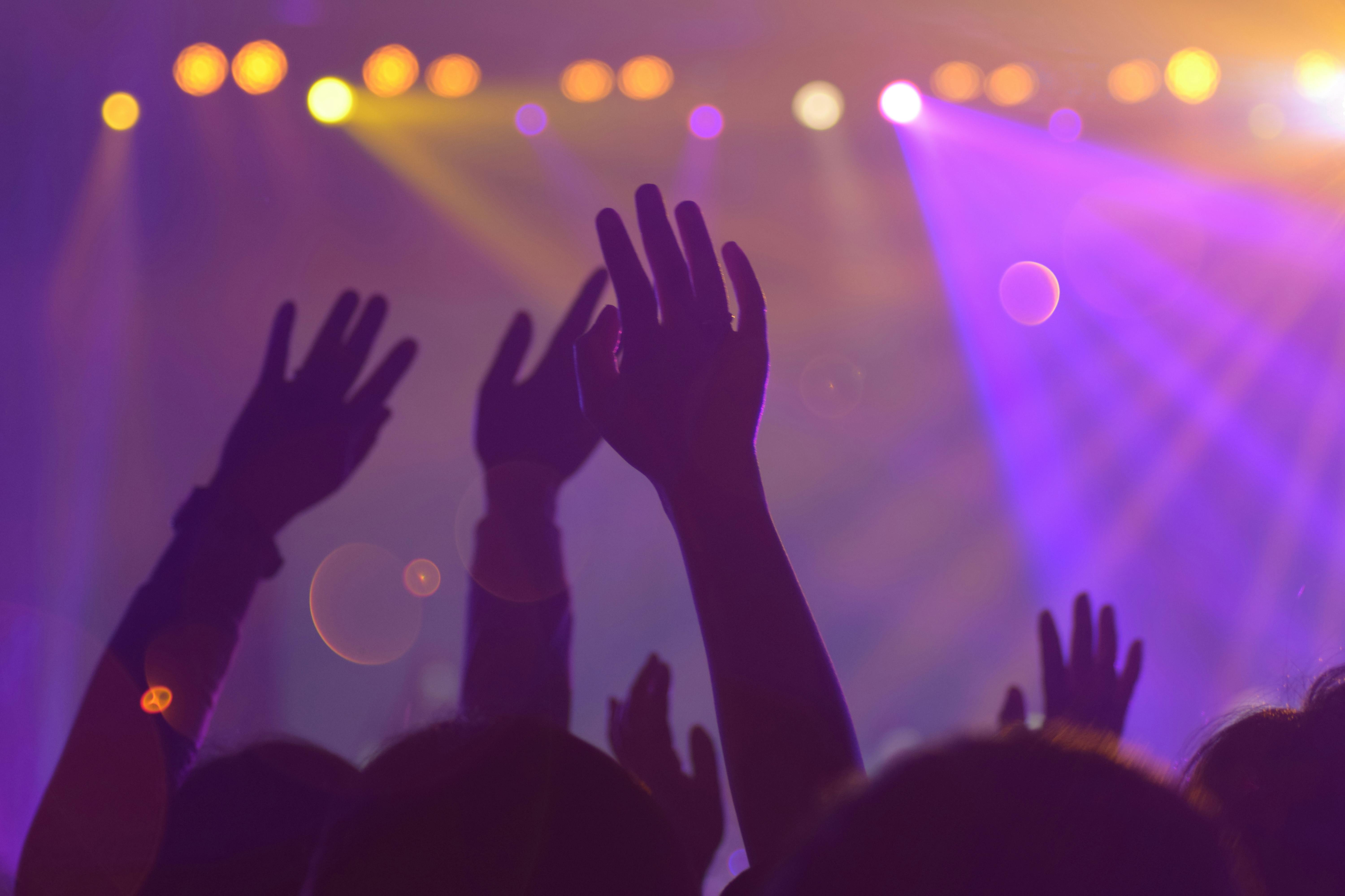 Live music performance with guitars and drums on outdoor stage